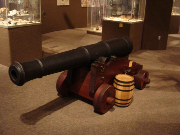 Caption 12- Front view of six pounder cannon. 