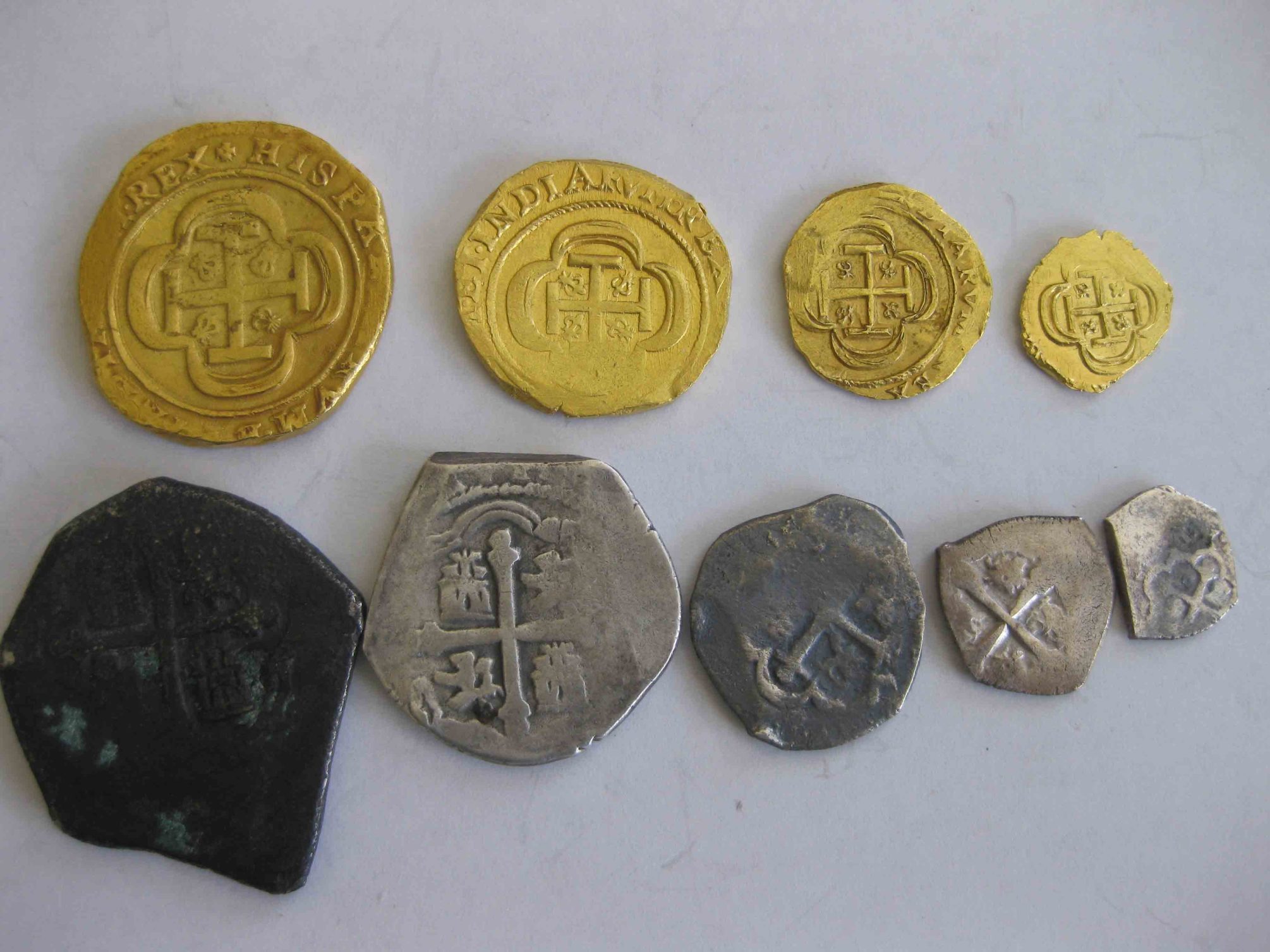 Mexico 1714 silver cobs and a complete set of Mexico 8 Escudos from 1714-obverse