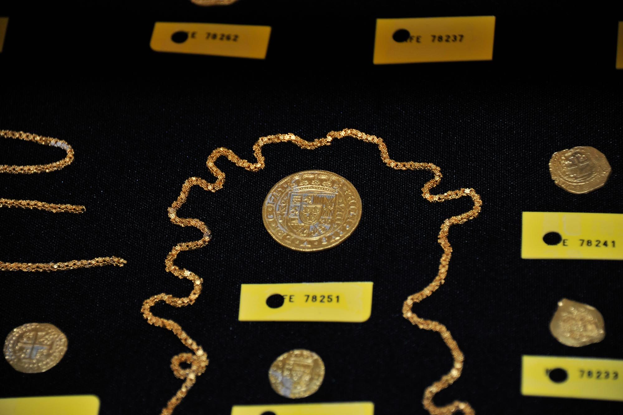 Close up of the 1715 Tricentennial Royal surrounded by gold chain