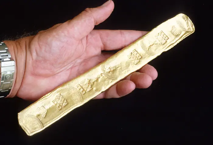 Caption 21- Full view image of caption 7, a Colombian gold bar of 20.75 kt struck at the Peña-Randa foundry 1621-22. Recovered from the Florida Keys wreck site of Nuestra Señora de Atocha - 1622.