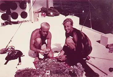 John de Bry (left) and Jim Shubert aboard the "Derelict" on the Cabin Wreck with silver coins and copper ingots (1968)