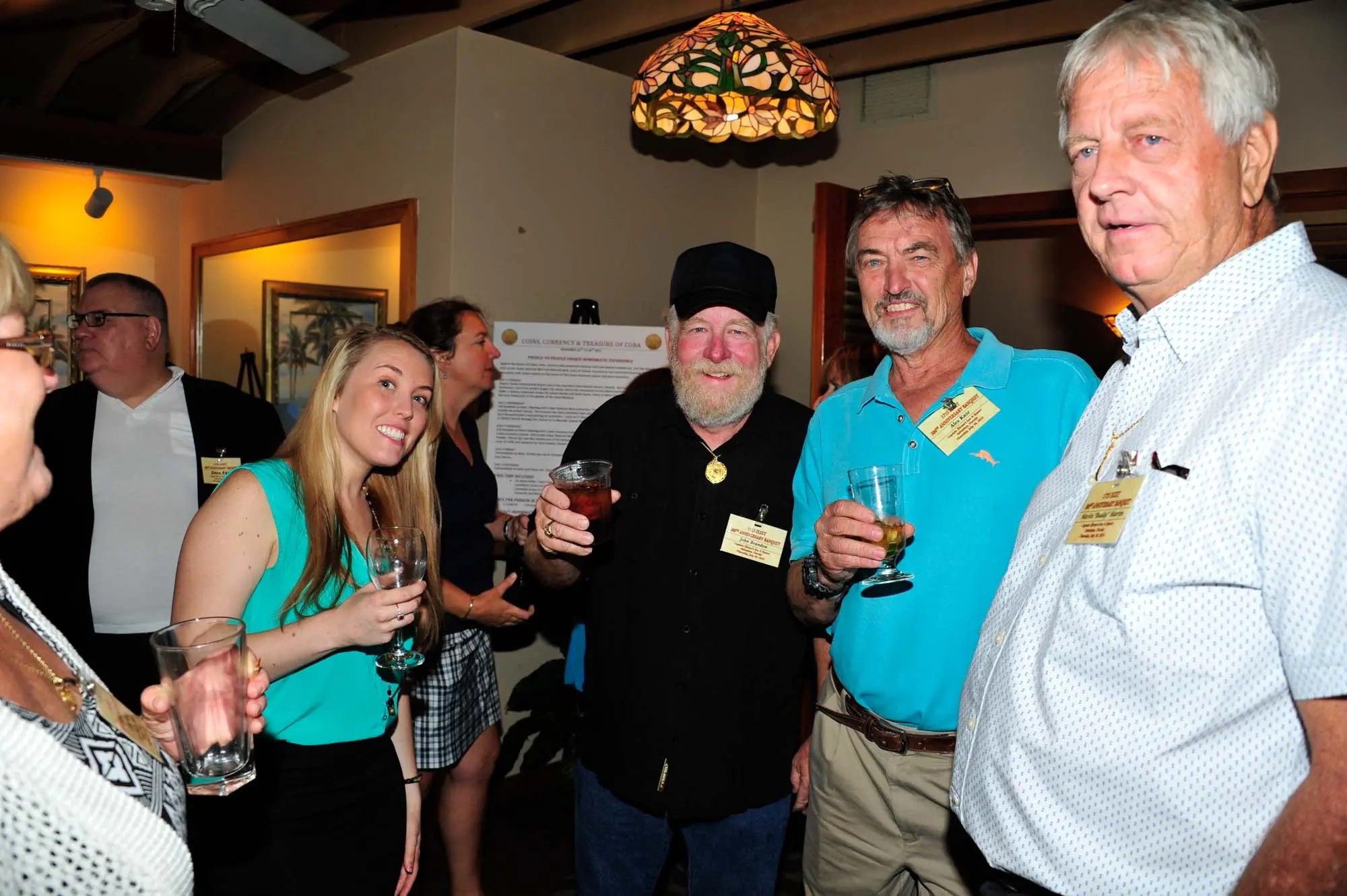 From right, Buddy Martin, Alex Kuze, and John Brandon share a drink