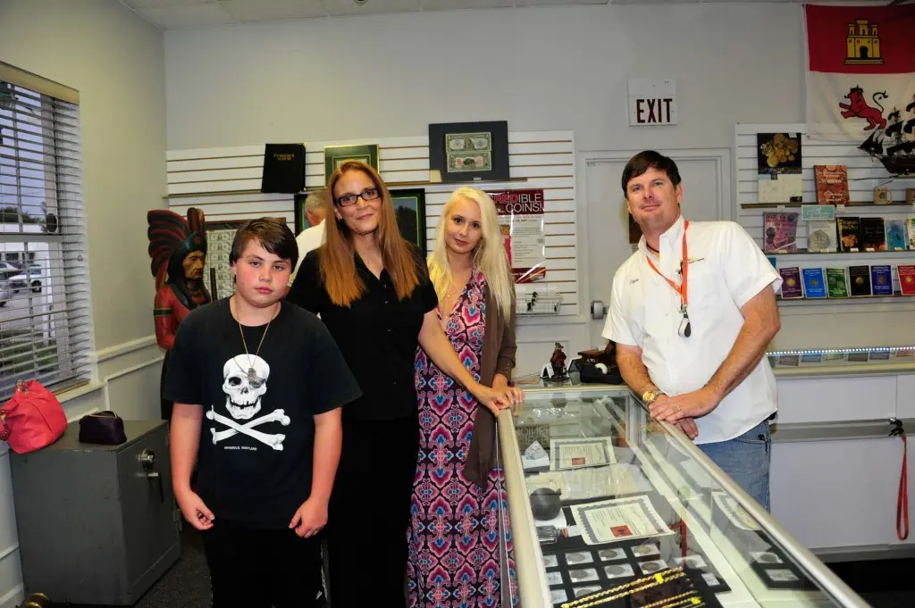 The McKee family and Clyde Kuntz pose for a quick photo