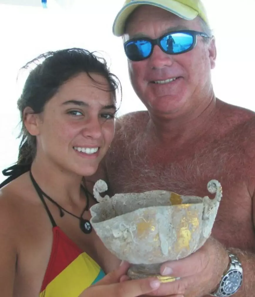 Dan Porter and daughter Allie Porter with the gold chalice recovered in 2008
